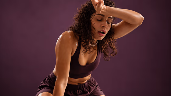 A tired woman resting after a workout
